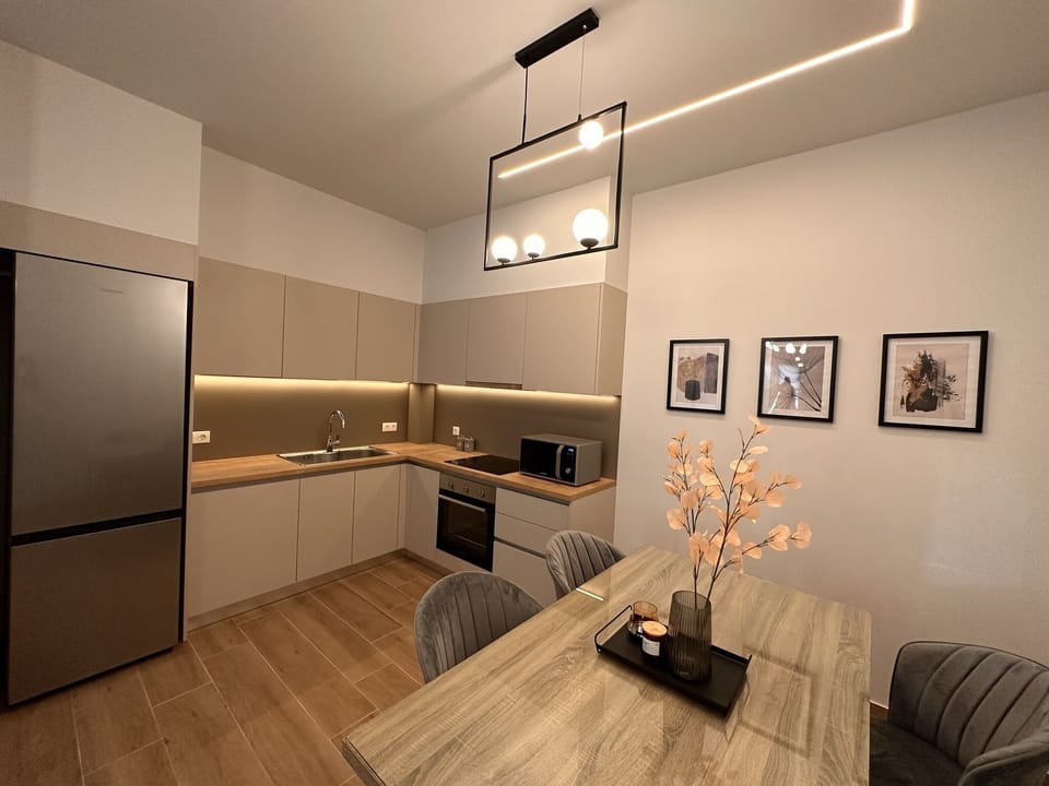 Comfort Apartment, Ground Floor (Armonia) | Private kitchen | Full-size fridge, microwave, oven, stovetop