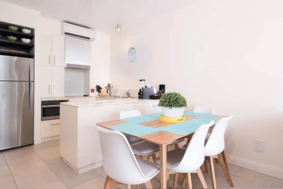 Dine inside or set up your laptops for work at the six-seater timber table.