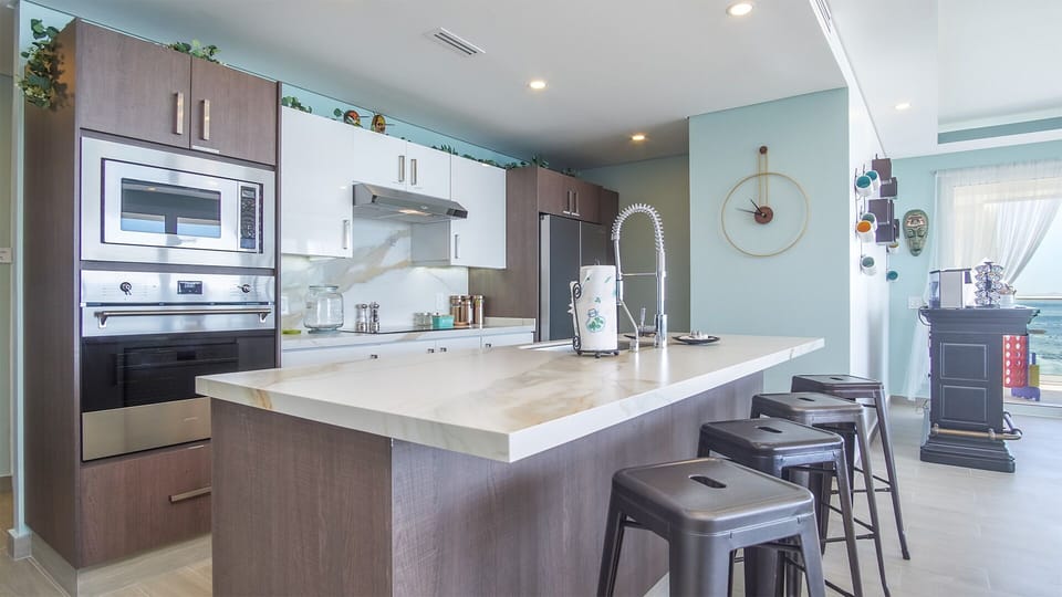 Kitchen Island serves a a bar, so everyone can hang out with the Chef.