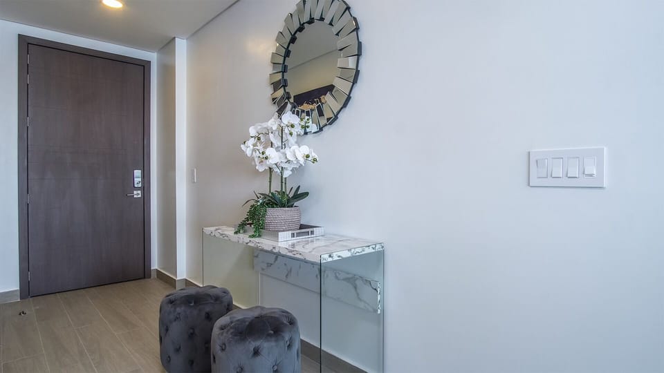 Cute side table at the condo entrance.