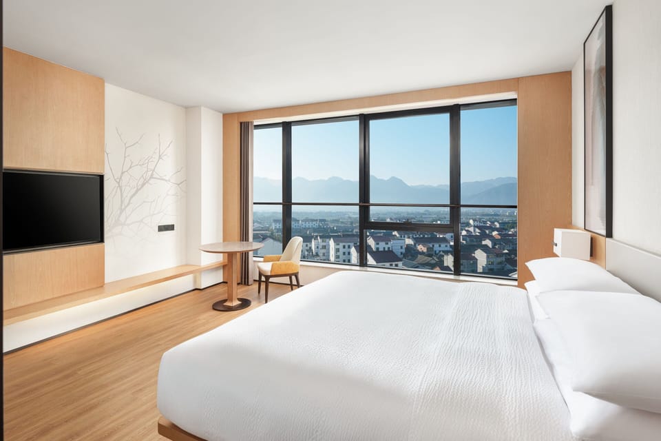 Premium Room, 1 King Bed, Mountain View | Down comforters, blackout drapes, iron/ironing board, free WiFi