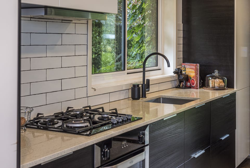 Deluxe Studio Suite | Private kitchen | Espresso maker, coffee/tea maker, full-size fridge, microwave