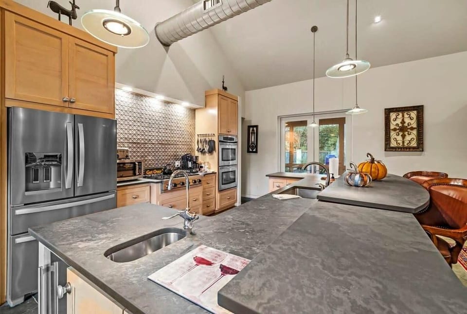Full kitchen with amenities and bar seating