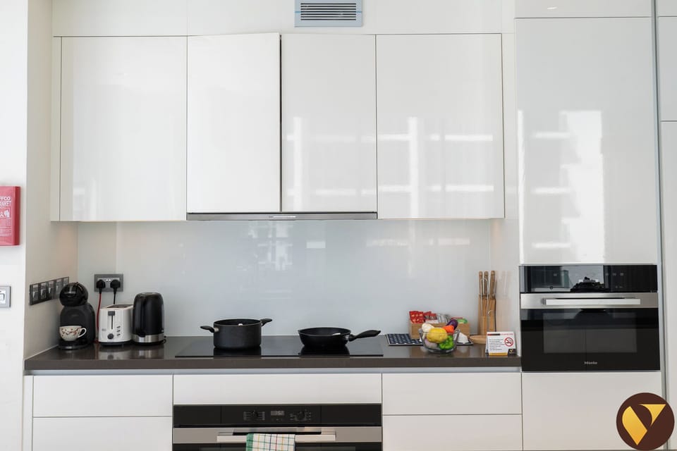 Luxury Apartment | Private kitchen | Full-size fridge, microwave, oven, stovetop