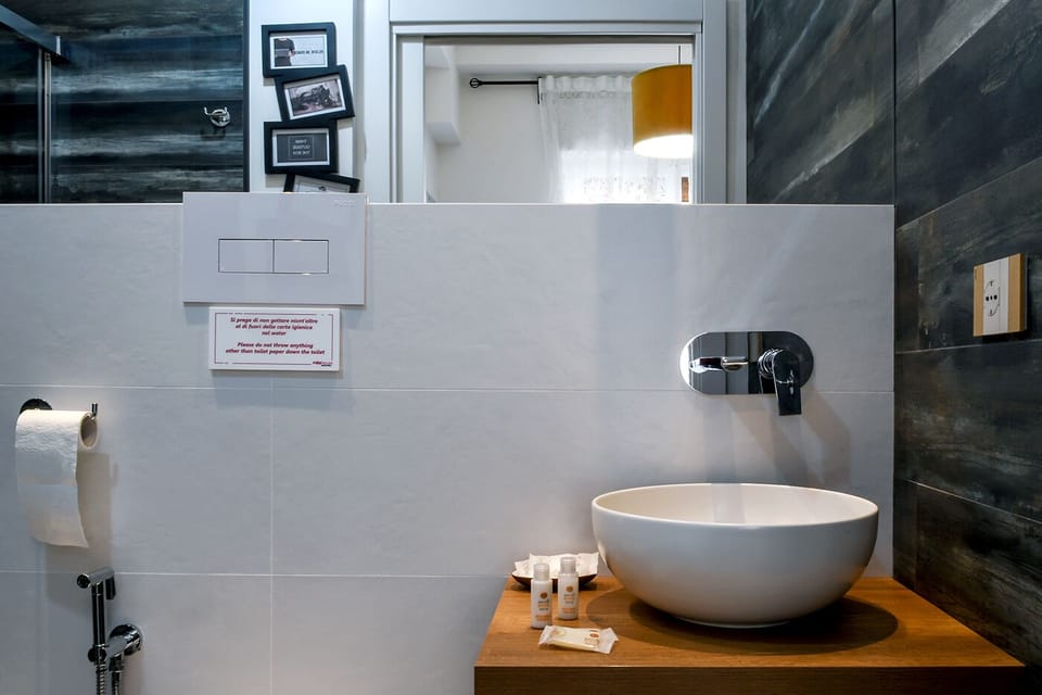 Roxy | Bathroom | Shower, rainfall showerhead, hair dryer, slippers