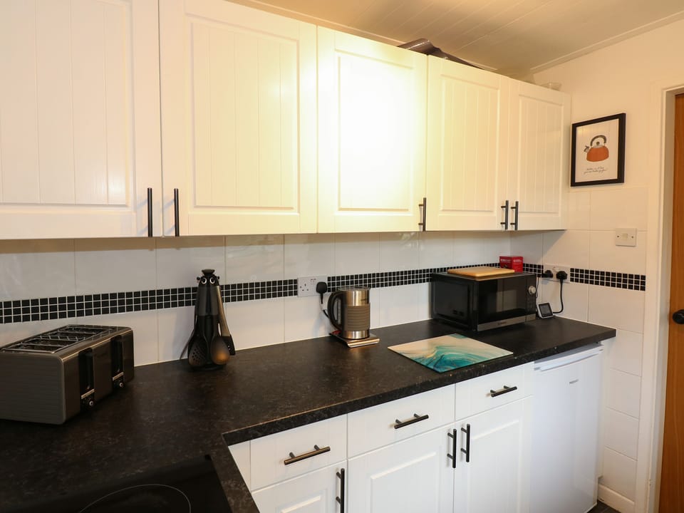 Fridge, electric kettle, toaster, cookware/dishes/utensils