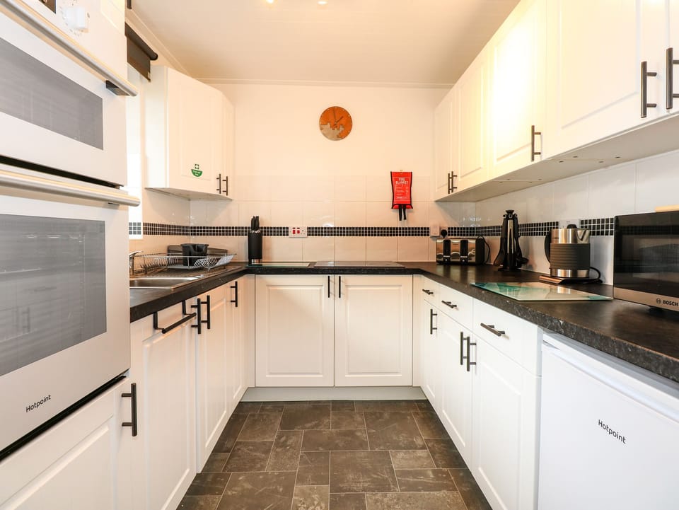 Fridge, electric kettle, toaster, cookware/dishes/utensils