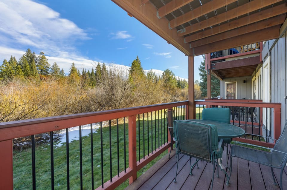 Enjoy your morning coffee on this peaceful balcony, surrounded by forest views and mountain vistas that stretch endlessly before you.
