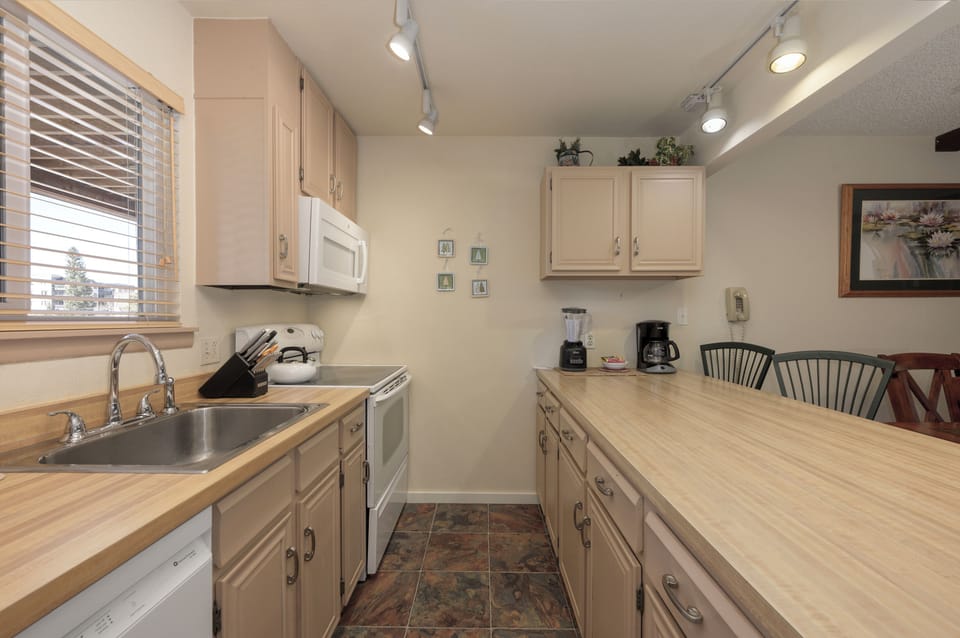 Cook your favorite meals in this fully equipped kitchen with modern appliances and ample counter space for your culinary adventures.