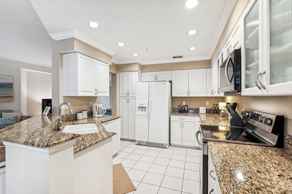 There is down lighting in the kitchen