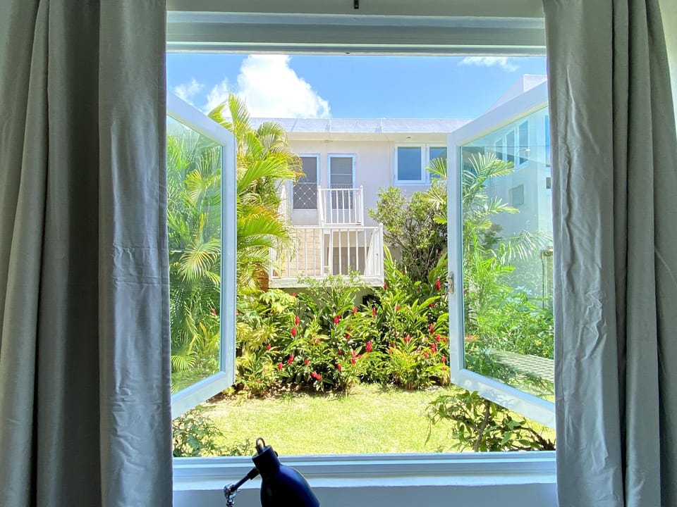 The view of the shared backyard from the desk in master bedroom
