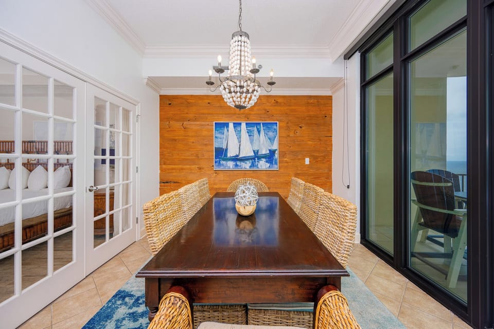 Gather around the table to share laughter and stories, with a calming coastal vibe framing your experience