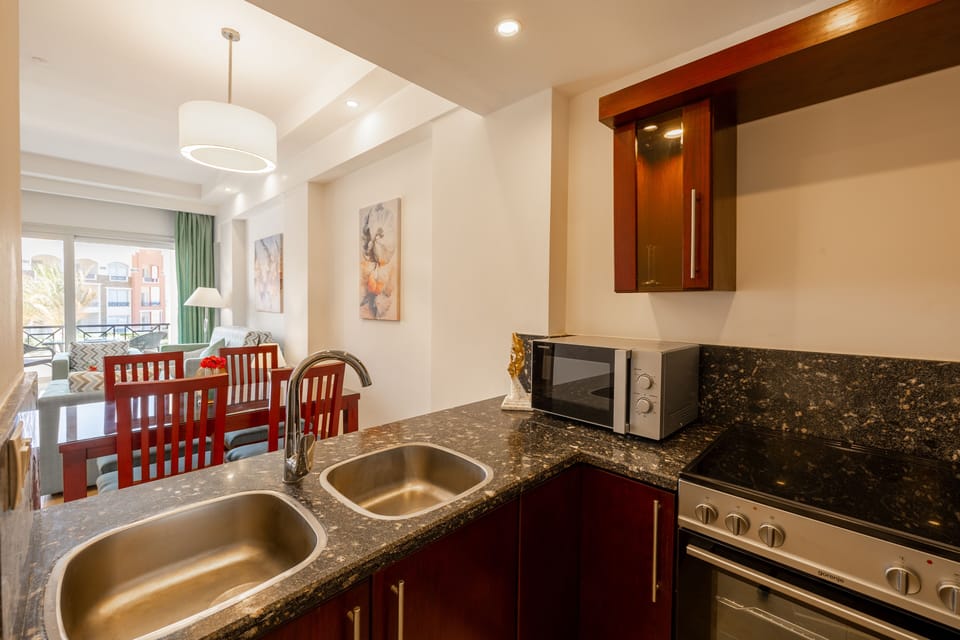 Two Bedrooms | Living area | 40-inch flat-screen TV with cable channels