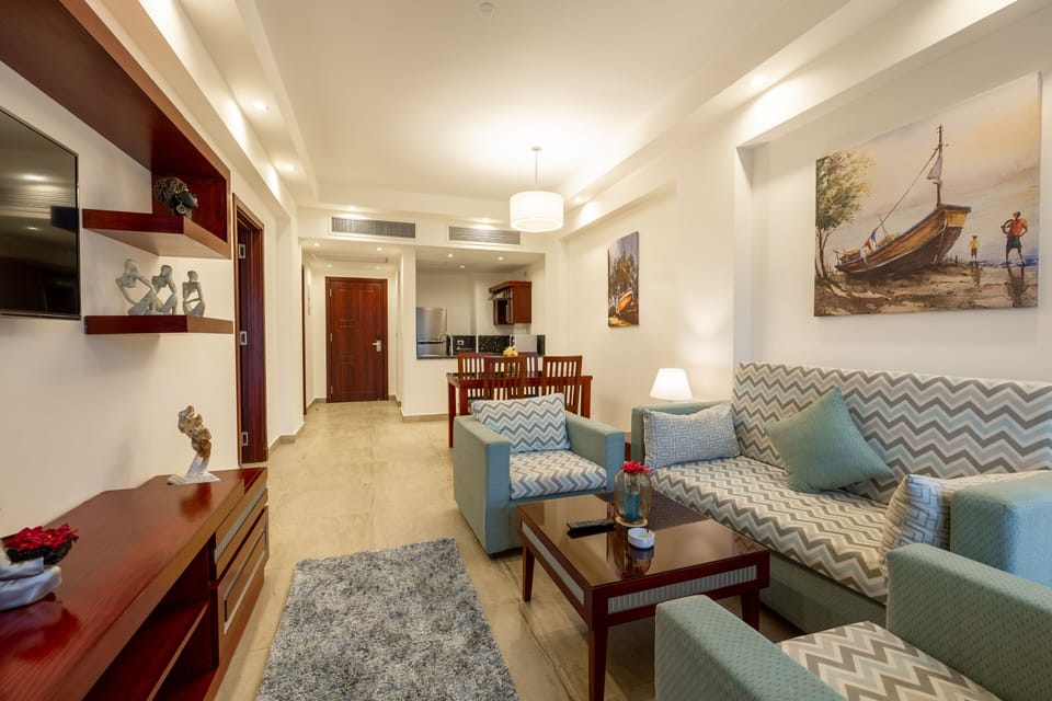 One Bedroom | Living area | 40-inch flat-screen TV with cable channels