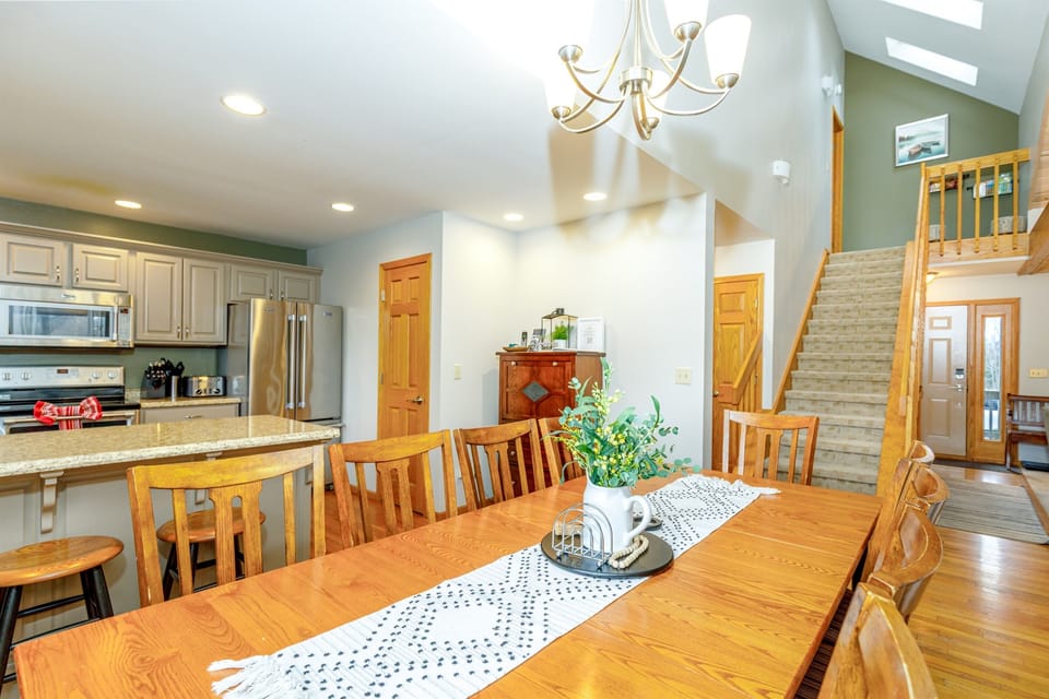 The dining table seats 8 with additional seating available at the breakfast bar