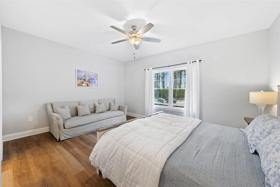 This bedroom offers a Cozy Couch to sit and relax!