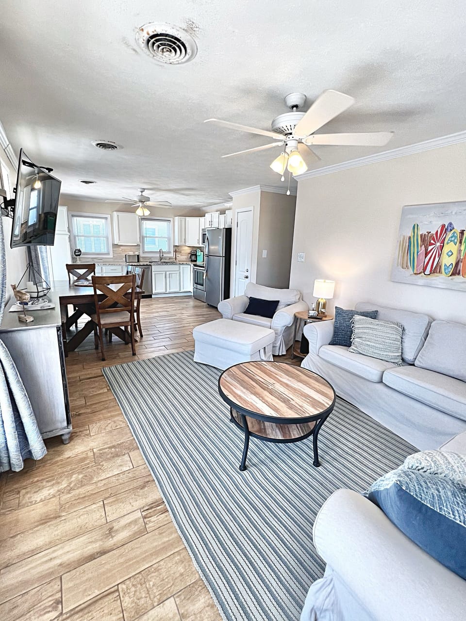 Living room with comfortable seating and television.