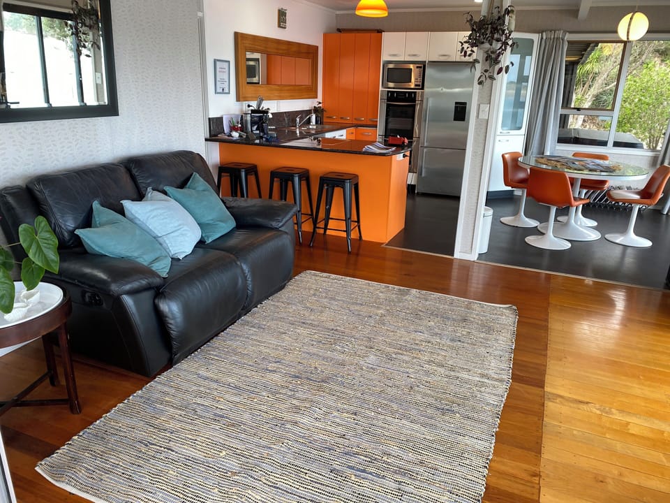 Downstairs lounge and kitchen leading out to the large deck.