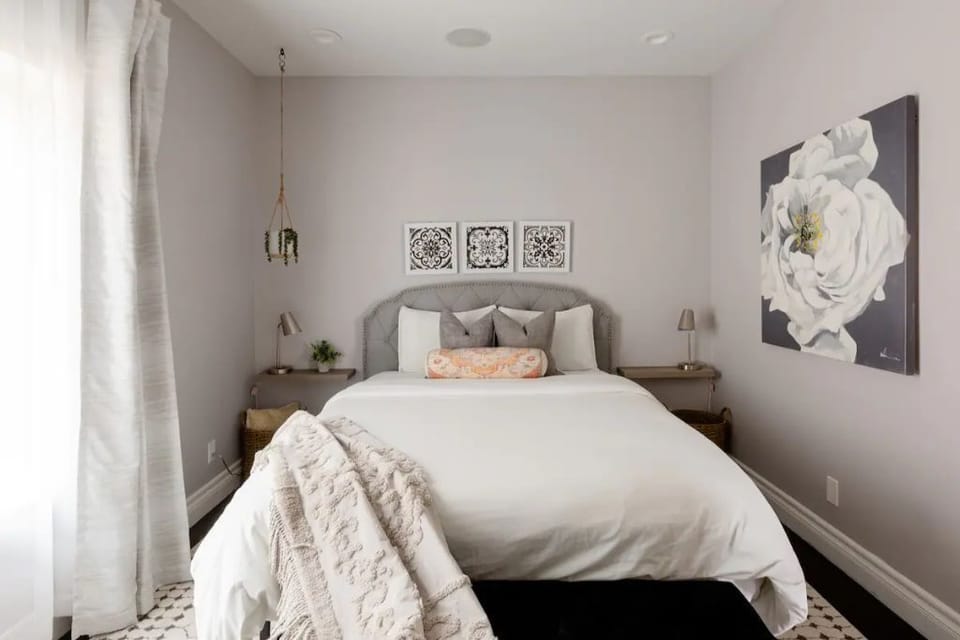 Bedroom with cozy fresh white sheets and Queen size bed
