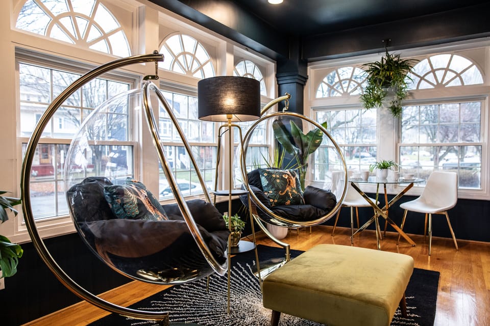 Jungle Room with 2 Bubble chairs and a bistro table. Enjoy coffee in a bubble!