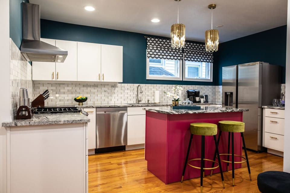 Beautiful kitchen that is fully stocked with cooking utensils, pots, pans