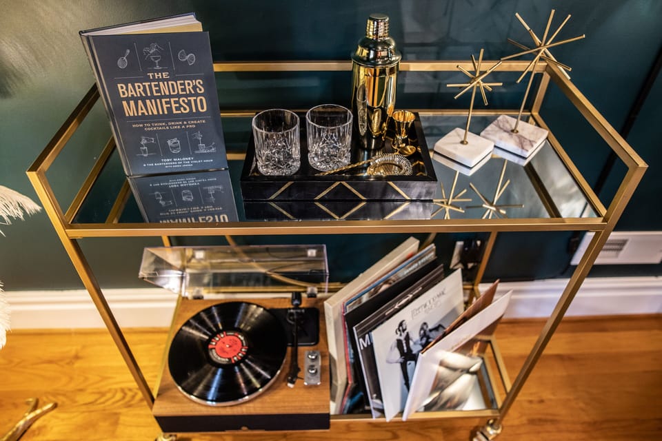 Vinyl record player with provided records. 