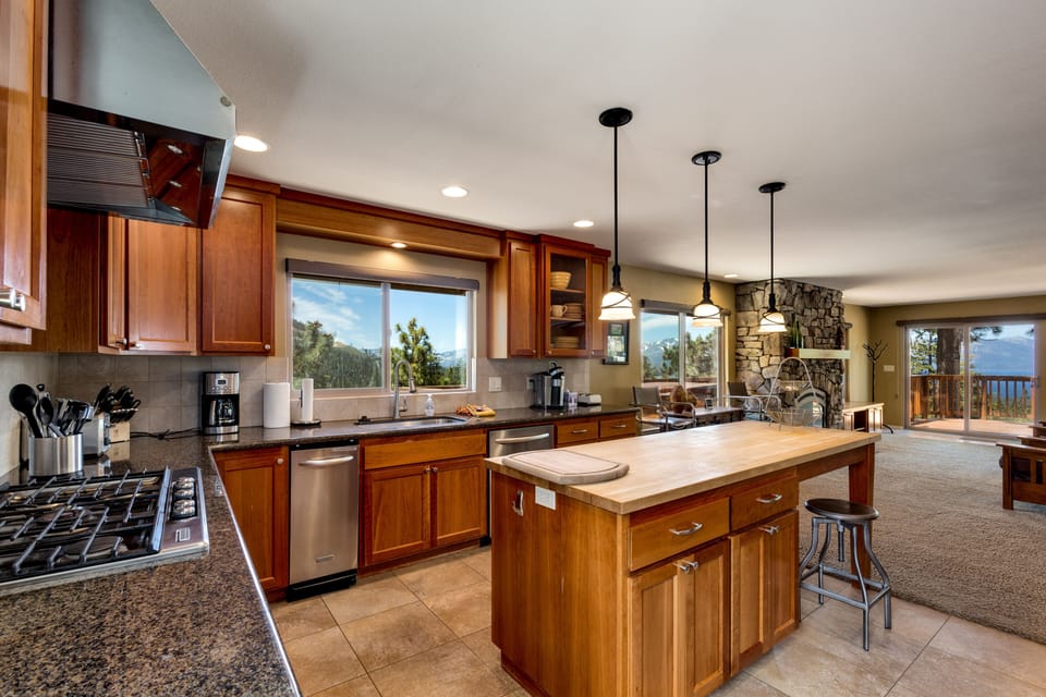 Cook with ease in the fully equipped kitchen featuring granite countertop