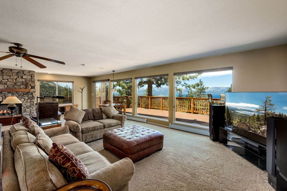 Relax in the spacious living room with floor-to-ceiling windows and stunning views