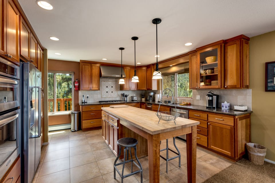 Fully stocked kitchen with modern appliances, ideal for preparing home-cooked meals
