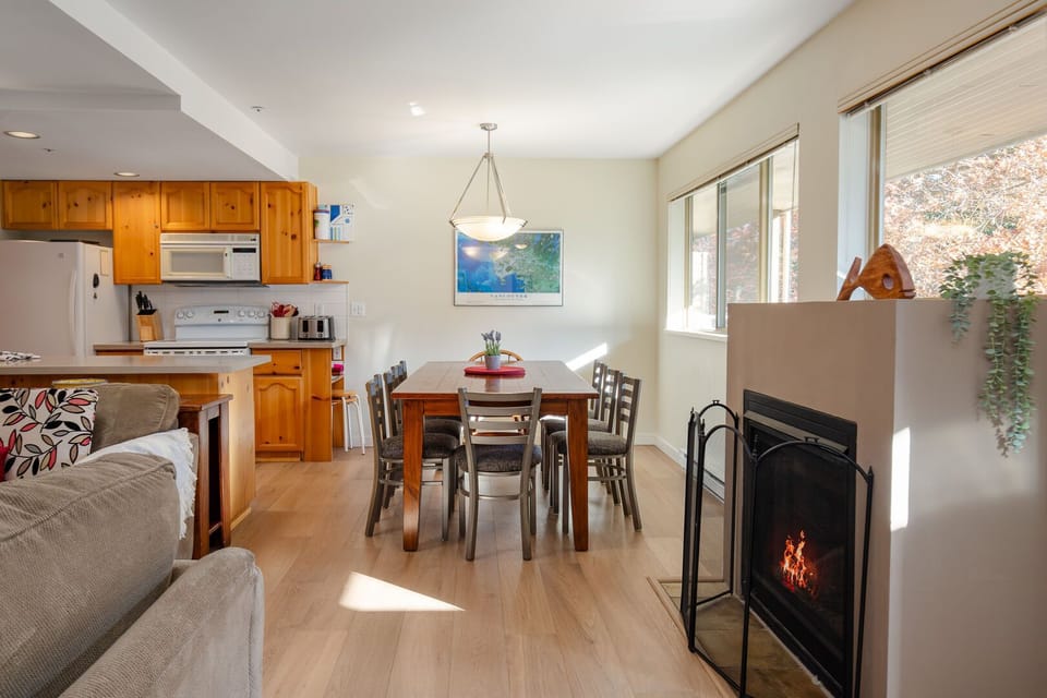 Bright open living space with cozy gas fireplace