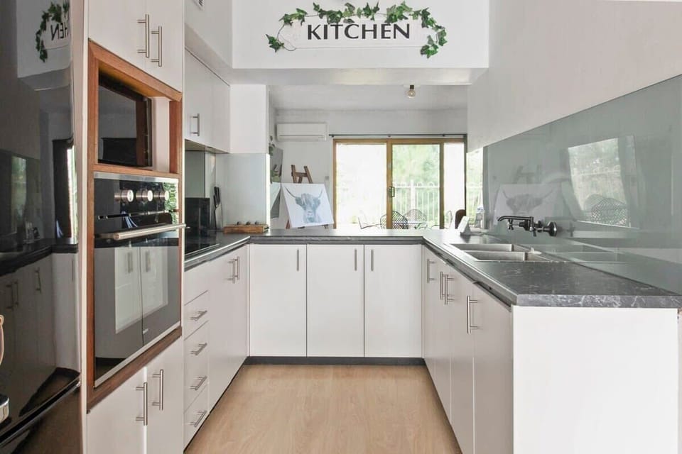 Kitchen + Coffee Machine + Breakfast Bar