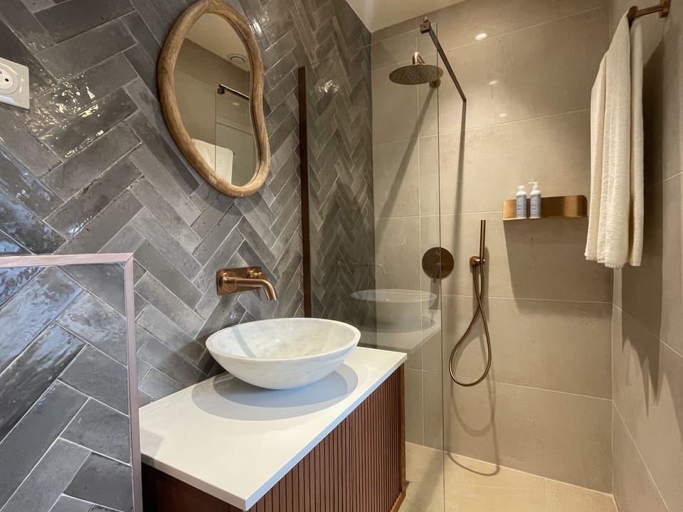 Superior Room | Bathroom | Designer toiletries, towels, soap, shampoo