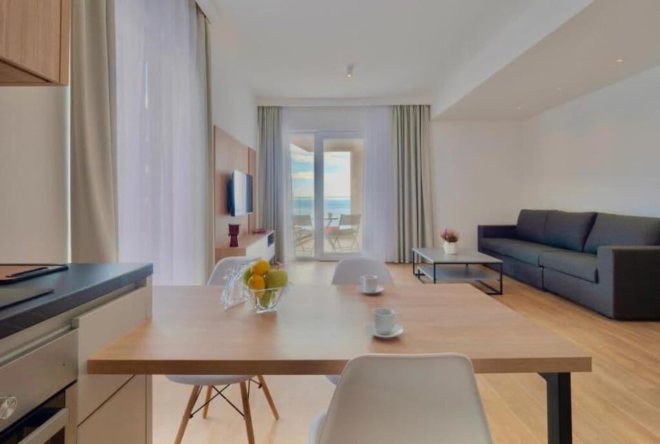 Deluxe Apartment | Living area | 32-inch LCD TV with cable channels