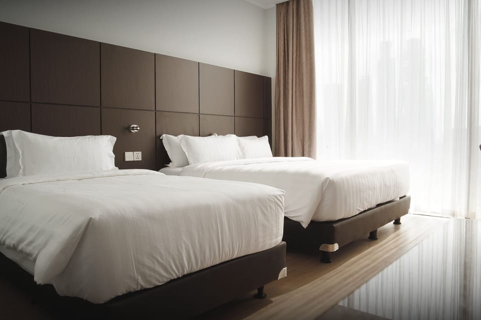 Executive Triple Room | Minibar, in-room safe, desk, soundproofing