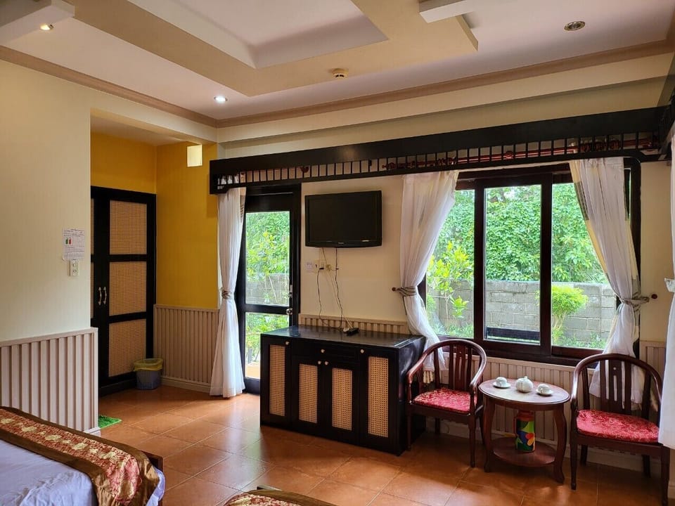 Deluxe Quadruple Room, Pool View | Minibar, in-room safe, soundproofing, WiFi (free)