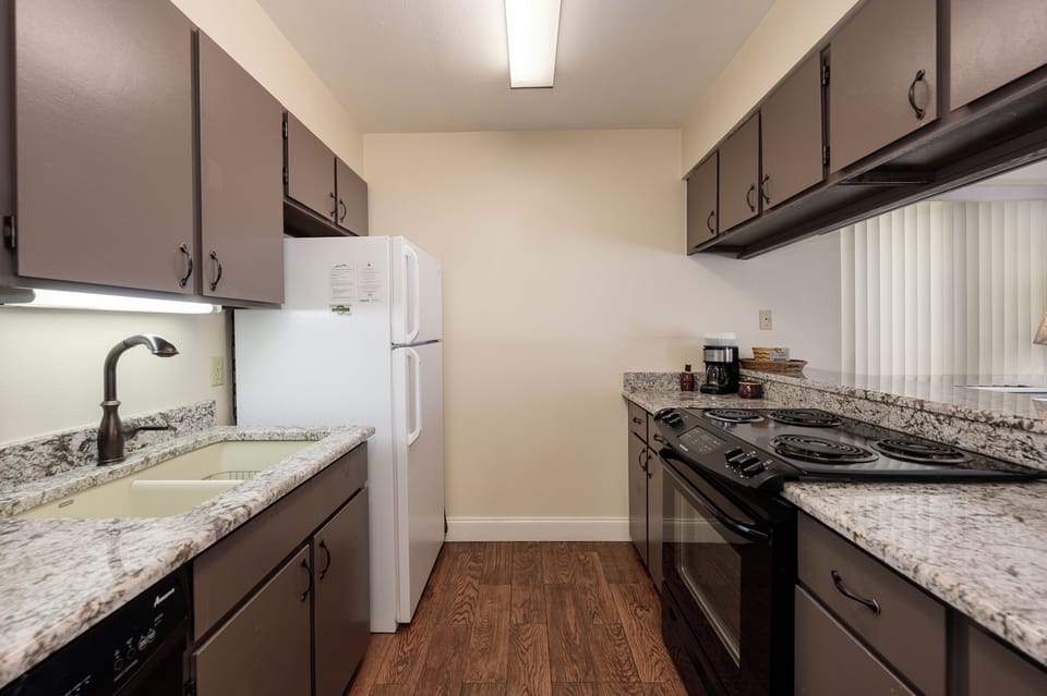 Your fully equipped galley kitchen features granite countertops, modern appliances, and everything you need to create memorable meals during your stay.