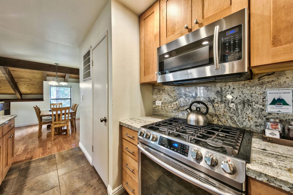 Cook memorable meals in your well-appointed kitchen featuring granite counters, stainless appliances, and gas range.
