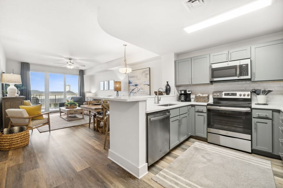 Modern kitchen and living area with ocean views and natural light