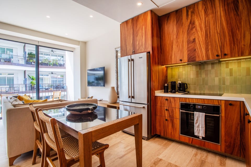 Kitchen amenities include a full-size refrigerator, stove, oven and dishwasher