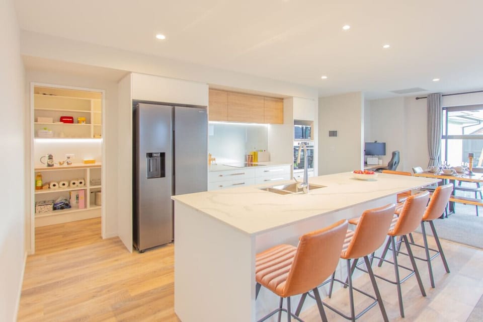 Gather your crew around the kitchen island while you cook—there is  room for everyone to hang out together.