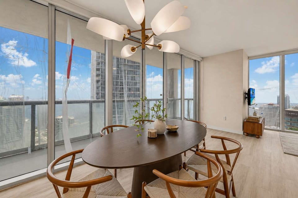 Spacious dining table to sit at while enjoying delicious meals and water views with your family and friends