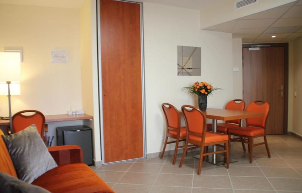 Family Room, 1 Bedroom, Non Smoking, Balcony | Living area | 32-inch flat-screen TV with digital channels, TV, offices