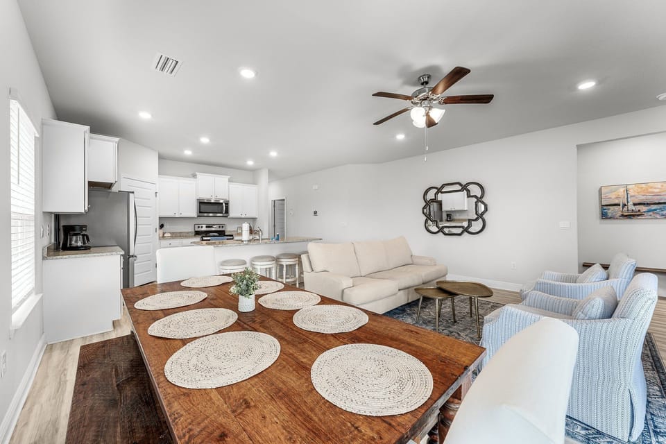 Your spacious open-concept living area seamlessly blends kitchen, dining, and lounge spaces for perfect gathering moments.