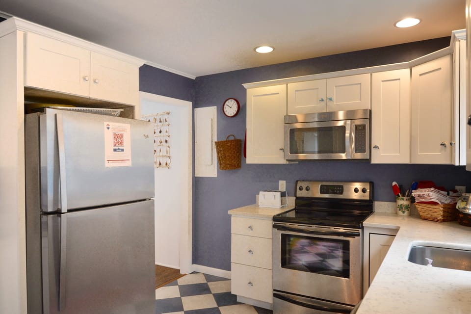 Small but mighty, this kitchen is well stocked and ready for you to prepare meals in if you like! There is also a gas grill for BBQ's!