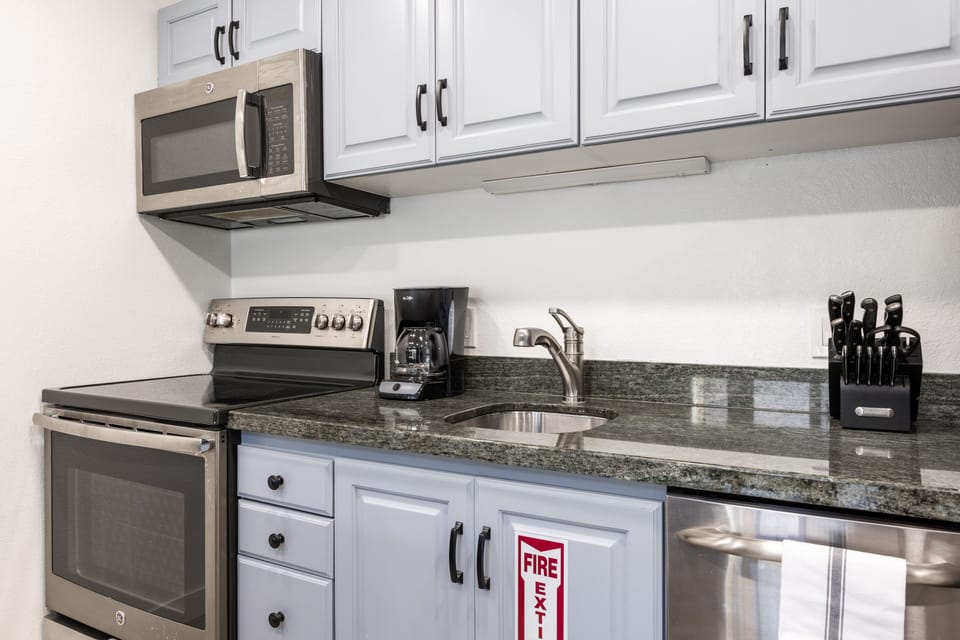 - Close-up kitchen with coffee maker ready for mornings  
- Knife set and cookware for easy in-condo dining nights  
- Modern appliances for a comfortable Park City vacation