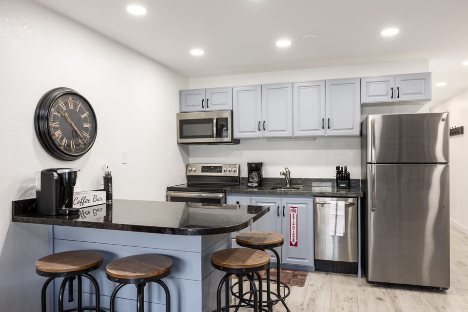 - Kitchen with sleek counters and ample cabinet storage  
- Fully equipped with stove, fridge, microwave, dishwasher  
- Enjoy cooking meals or quick snacks during your stay