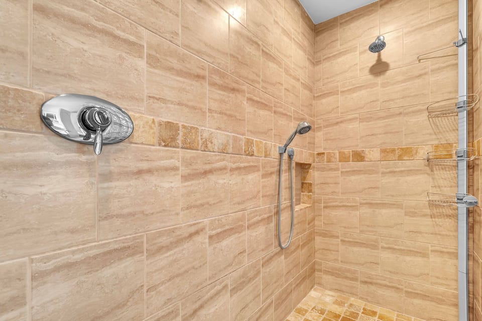 Spacious bathrooms featuring abundant storage options and equipped with essential amenities.