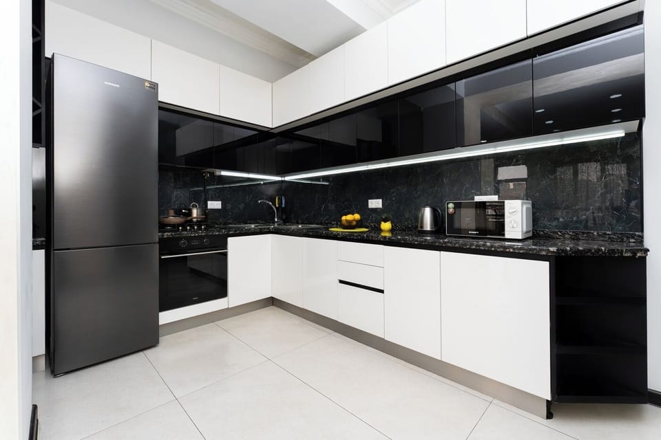 Family Apartment | Private kitchen | Fridge, stovetop, electric kettle, griddle
