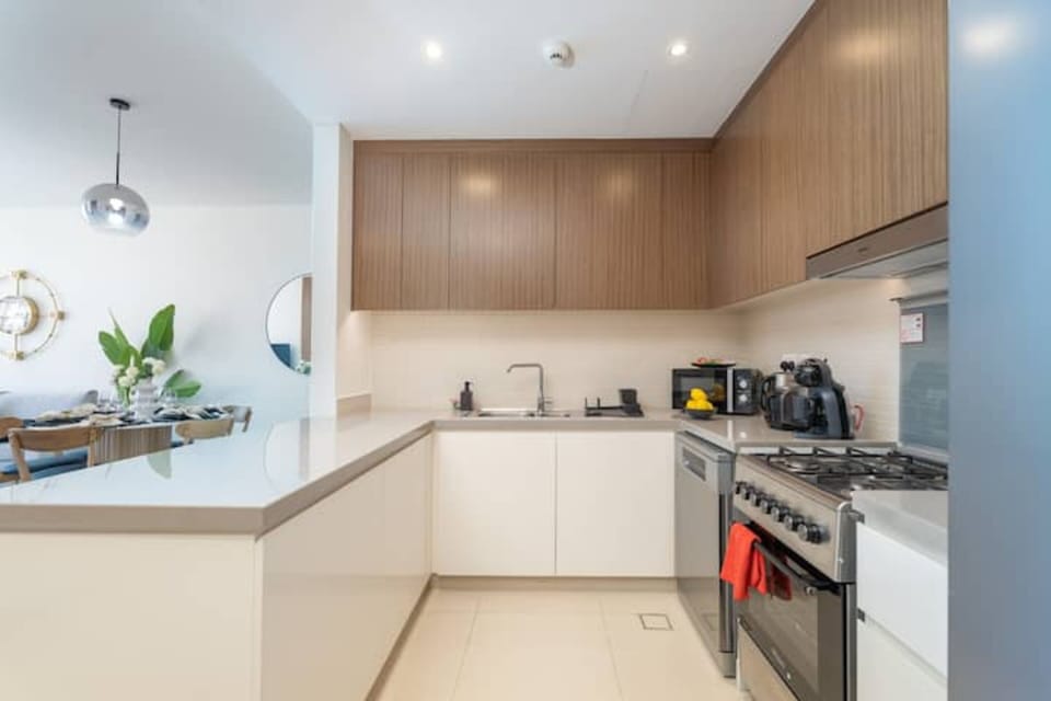 Elite Apartment | Private kitchen | Full-size fridge, microwave, oven, toaster
