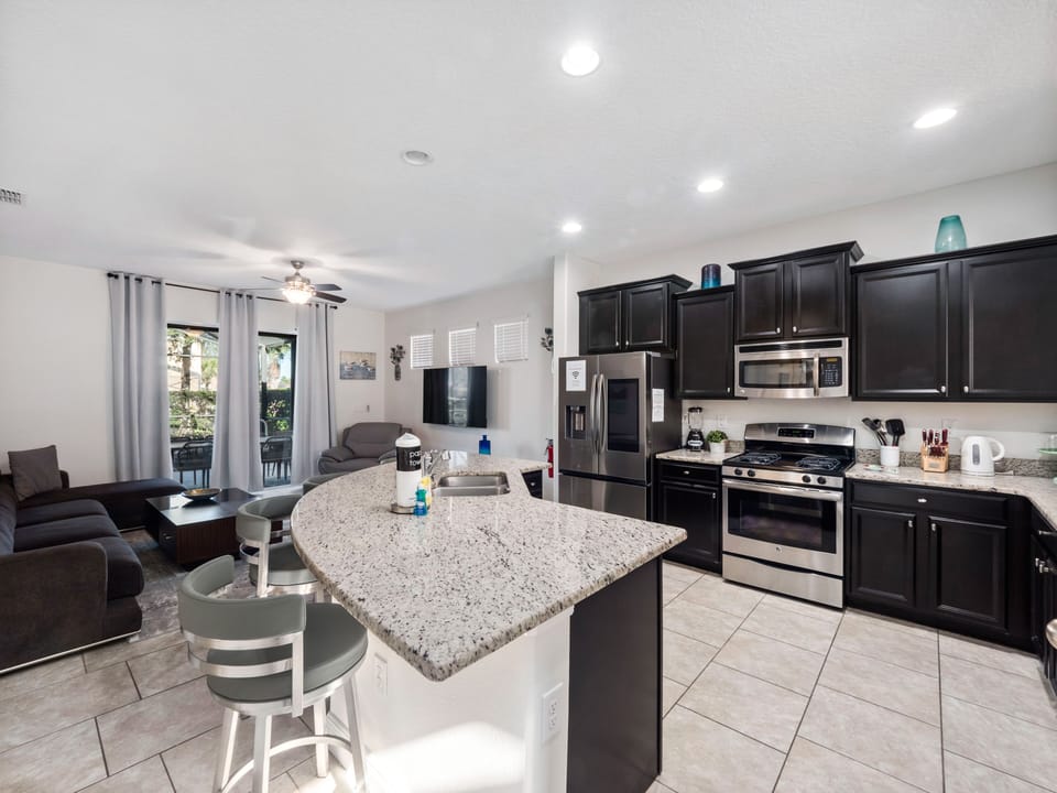 Modern Full Sized Kitchen Including Coffee Maker, Blender, Toaster, Basic Kitchen Starter Essentials and Bar Stool Seating